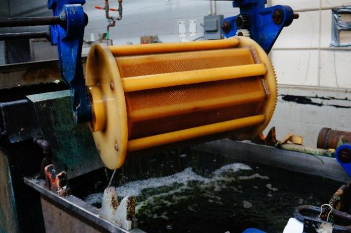 A photo of an aqueous cleaning barrel mid process